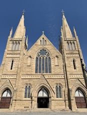 brown concrete church under blue sky during daytime