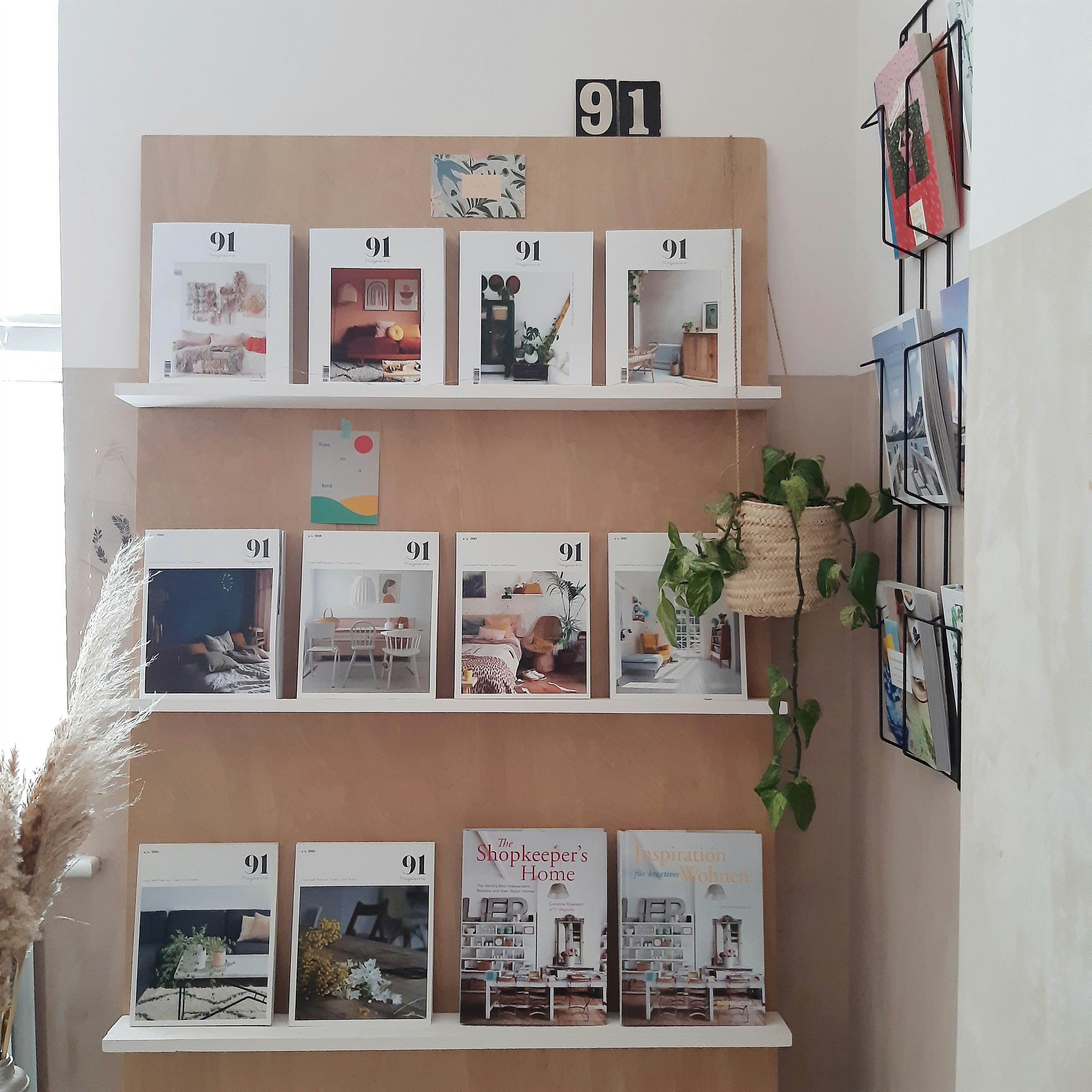 white wooden shelf with books