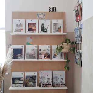 white wooden shelf with books