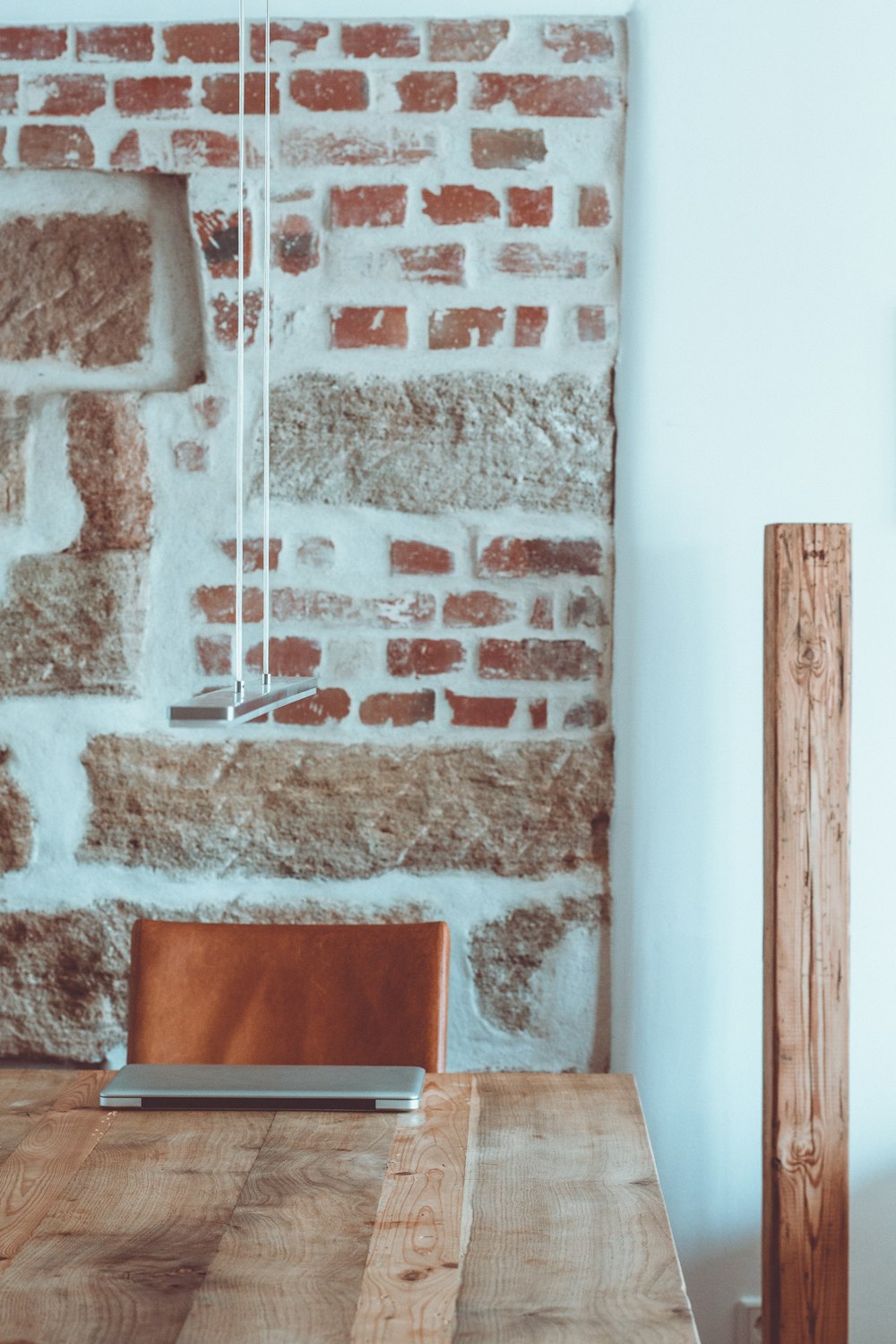 black laptop computer on brown wooden table