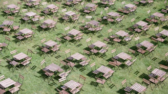 A bright, neatly arranged set of foldable tables ready for an outdoor event.