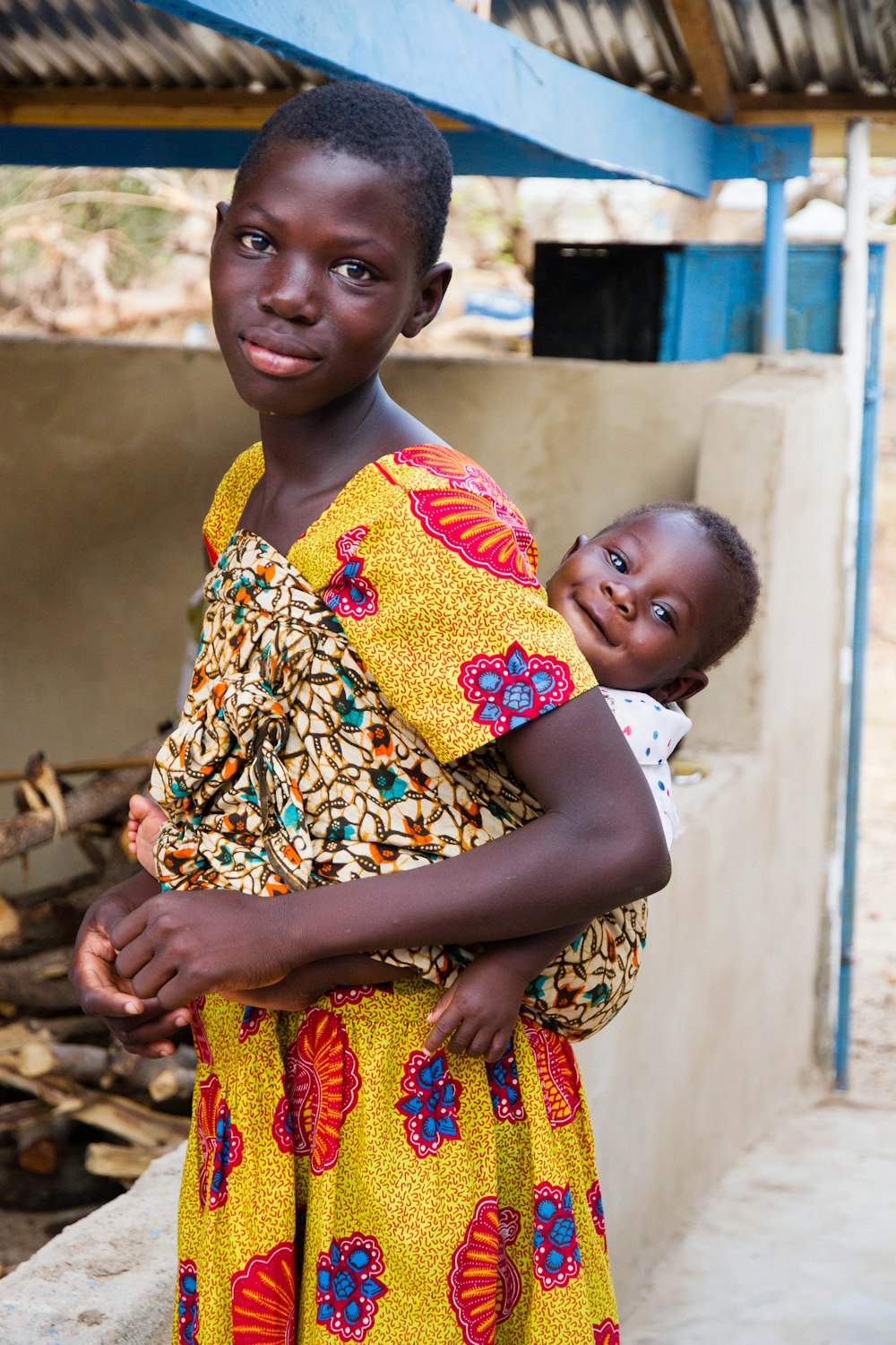 a woman holding a baby in her arms