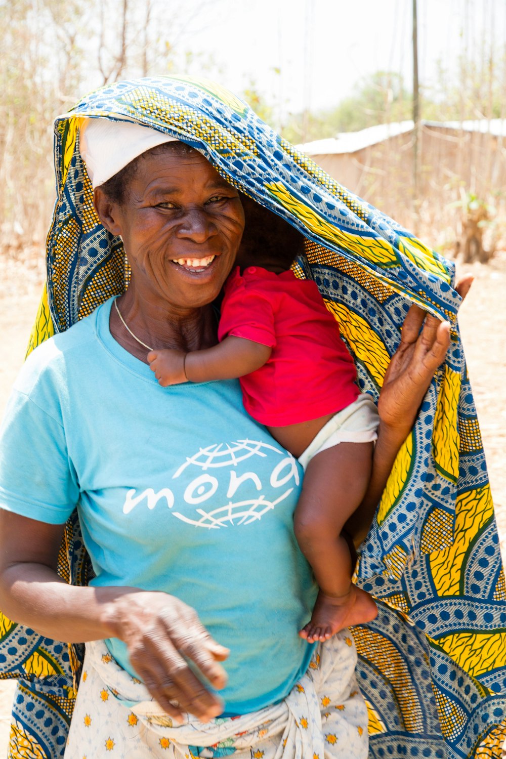 a woman holding a child in her arms