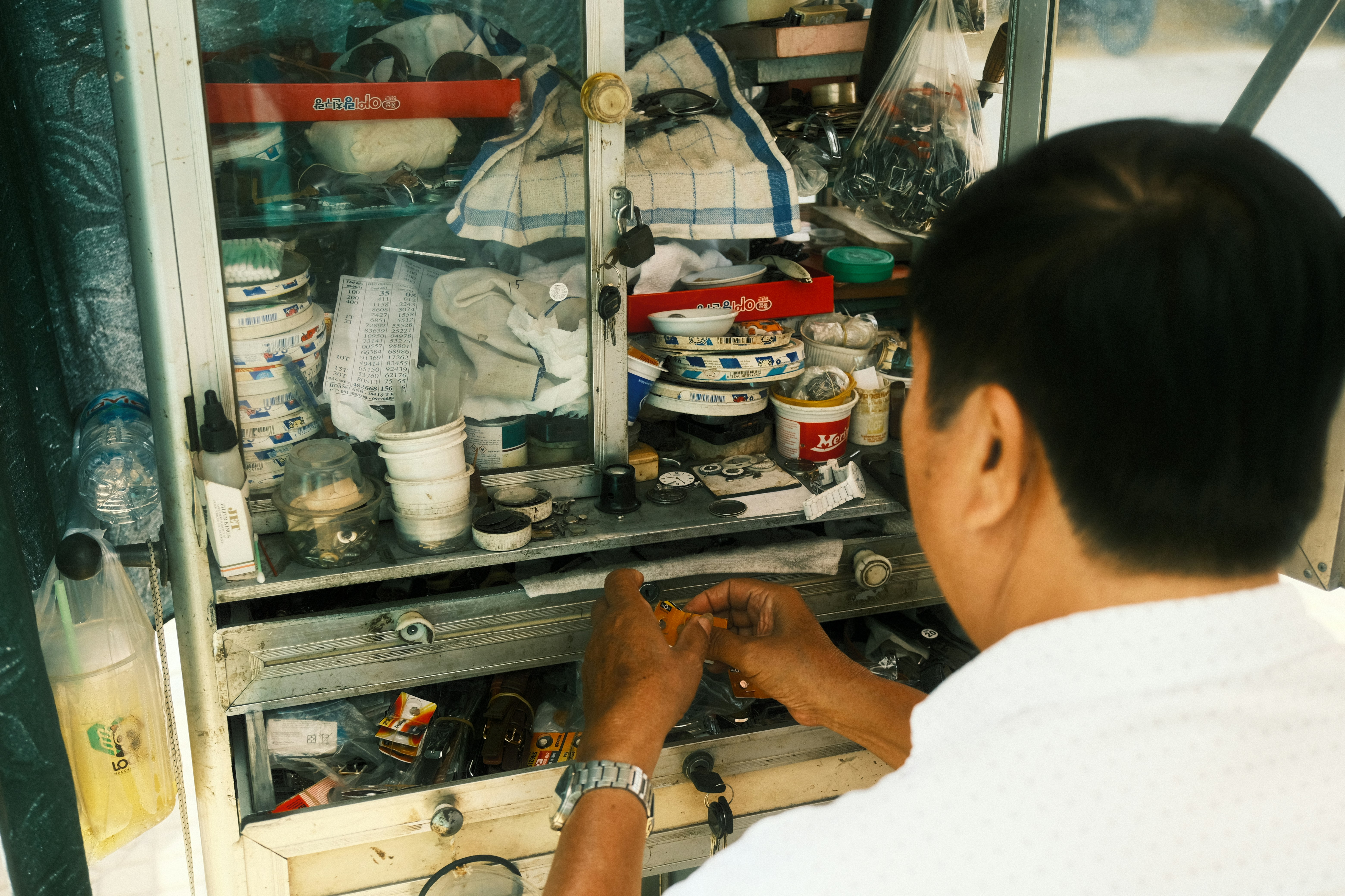 Woman in white shirt sitting at the table