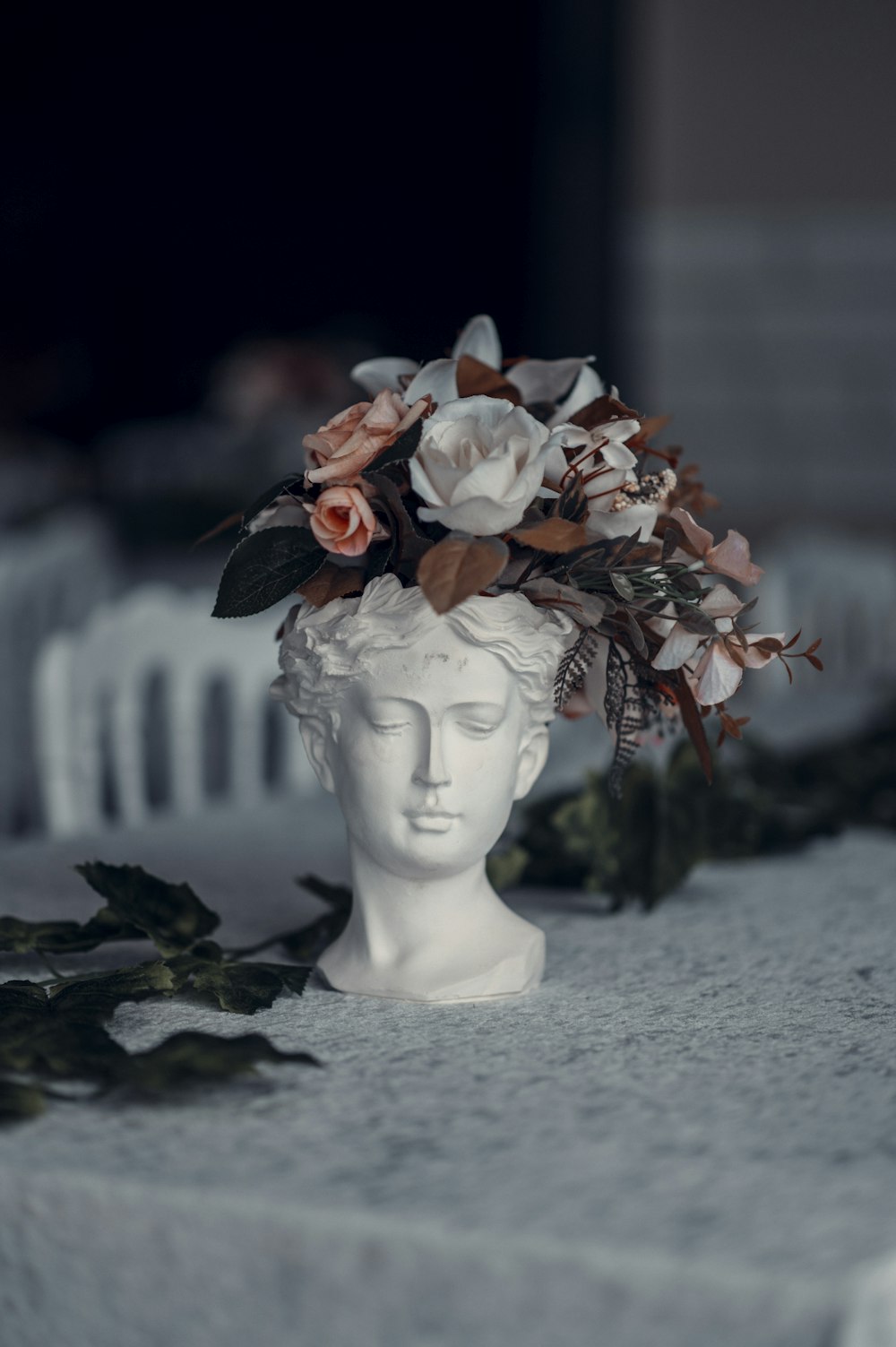 red and white flowers on white ceramic figurine