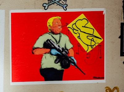 man in blue shirt holding rifle painting