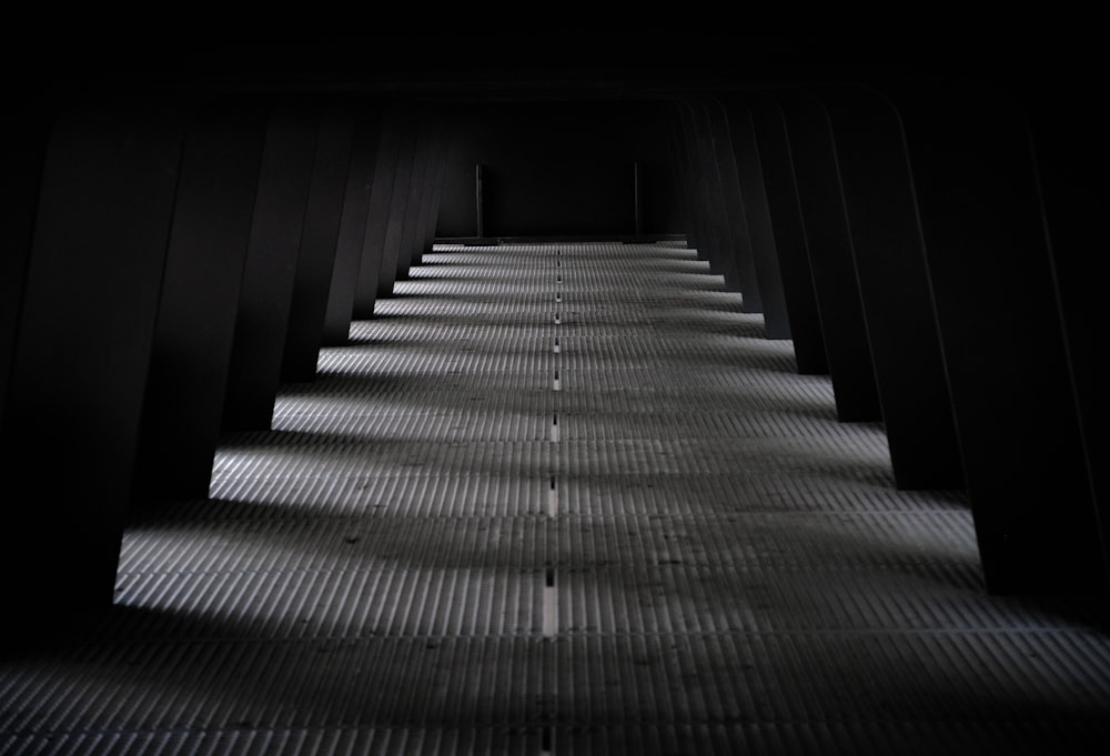 gray and black staircase in a dark room