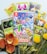 A collection of Pokémon trading cards and a Nintendo Switch game case titled 'New Pokémon Snap.' The cards feature various Pokémon characters surrounded by tropical foliage, colorful flowers, and small ornamental plants.