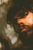 A cinematic video still of a portrait session with soft lighting and thoughtful composition.