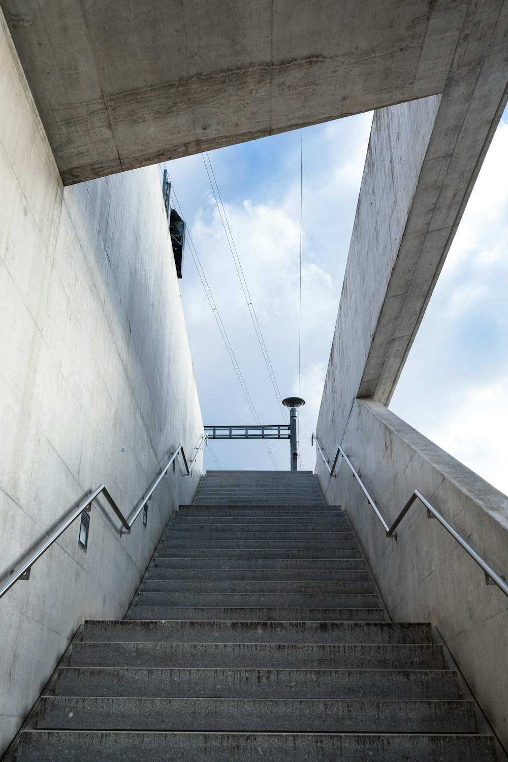 person in black jacket walking on stairs