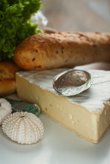 white and brown round pastry on white ceramic plate
