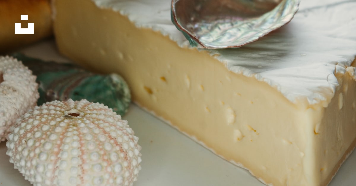 White and brown round pastry on white ceramic plate photo – Free Bread ...