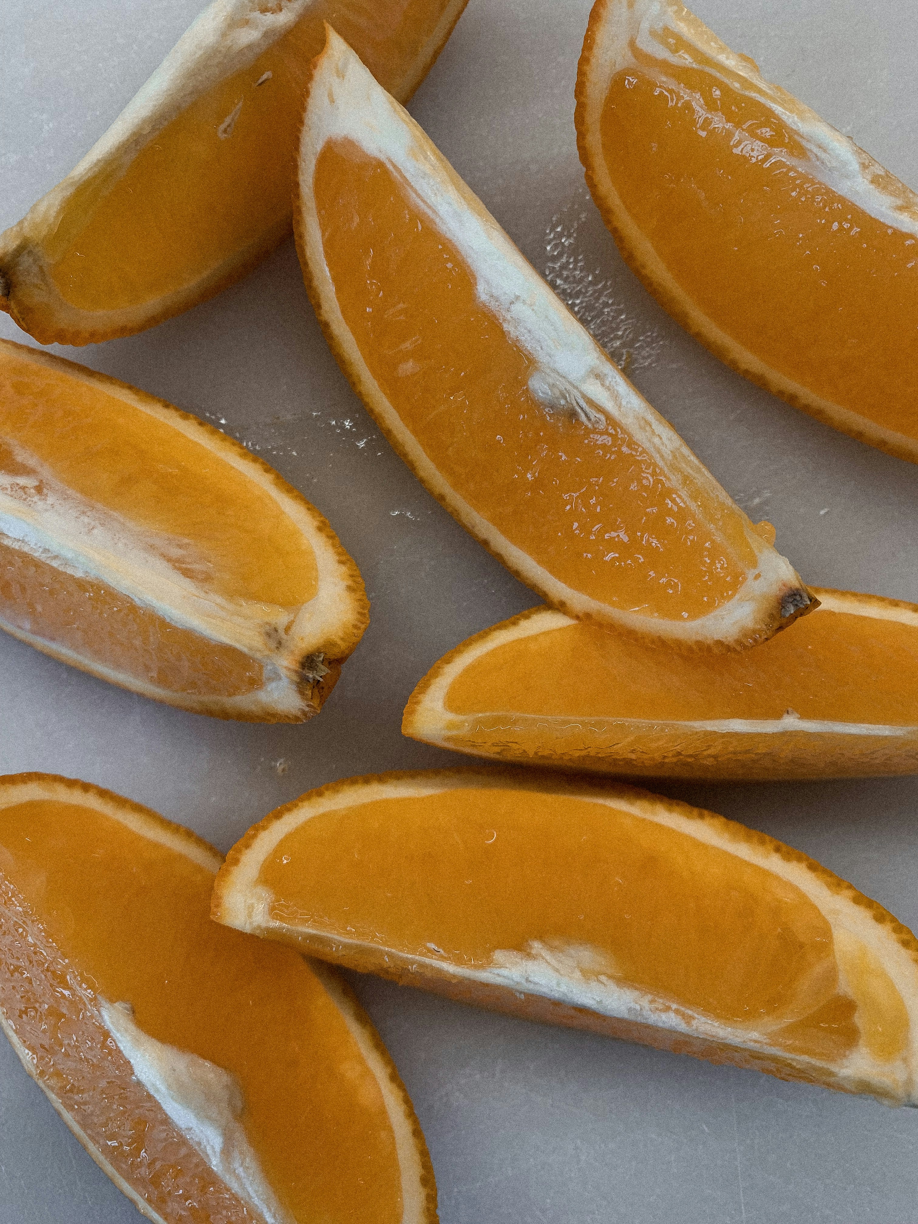 sliced orange fruits on blue tray