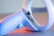 Close-up of wireless joysticks with glowing blue accents on a modern desk.