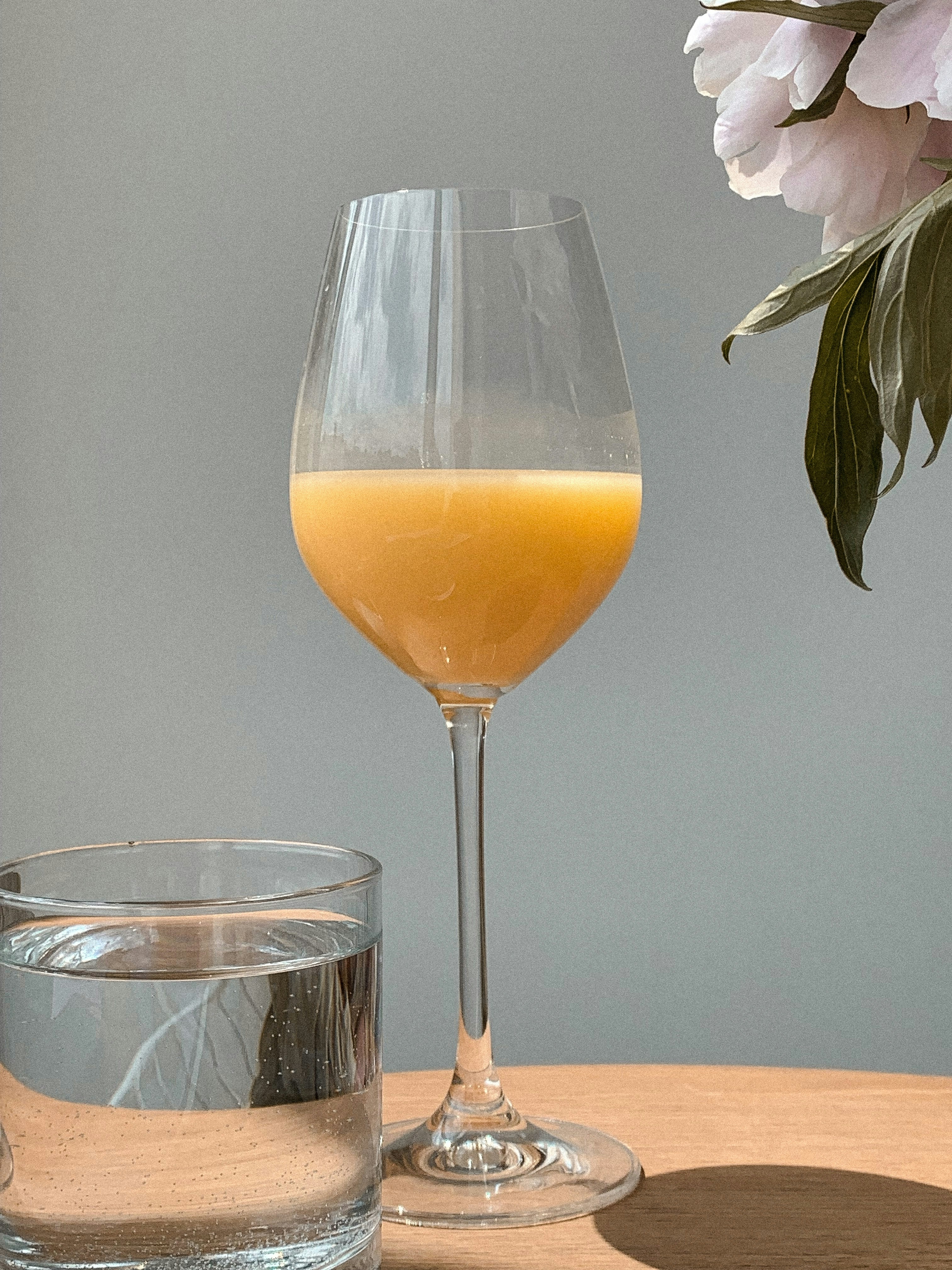 clear wine glass with yellow liquid