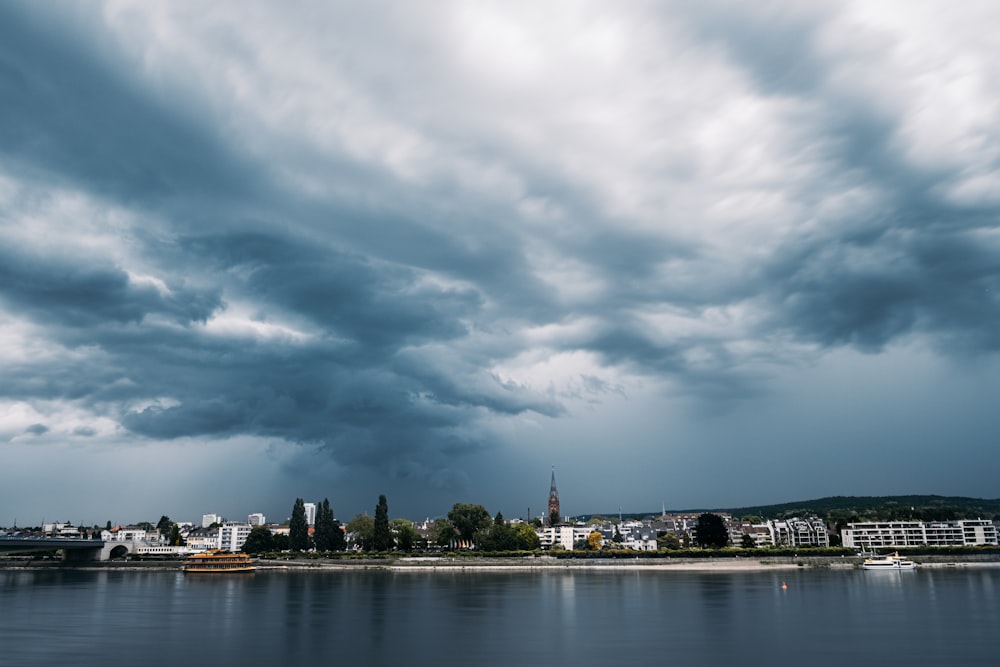 city skyline under cloudy sky during daytime