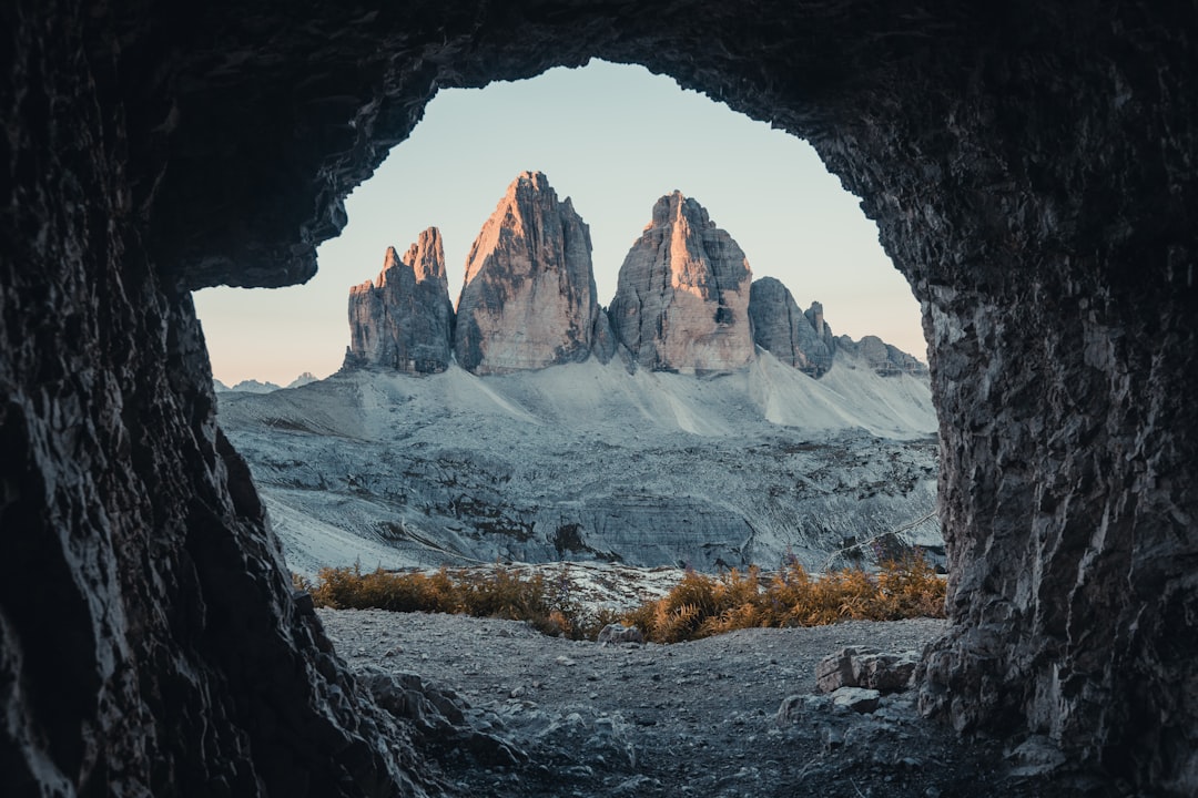 brown and gray rock formation, Sunset sunny photoshoop hike hiking travel Italy Dolomites mountains