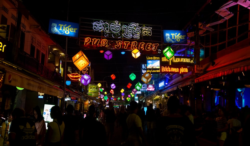 people walking on street during night time