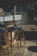 Porcelain countertop in a stylish bar setup with ambient lighting.