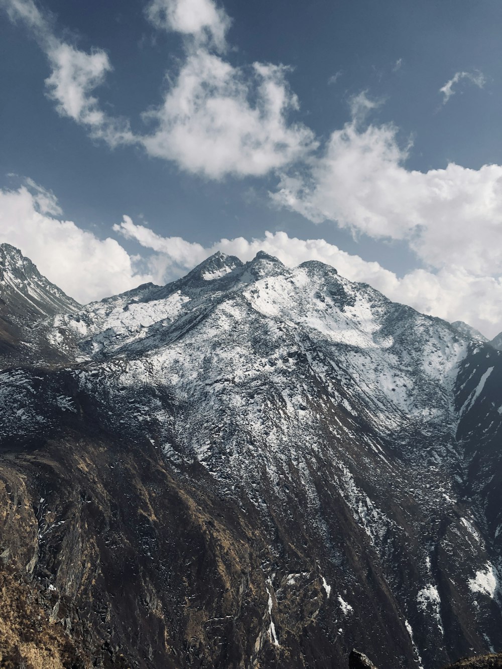 snow covered mountain under blue sky during daytime