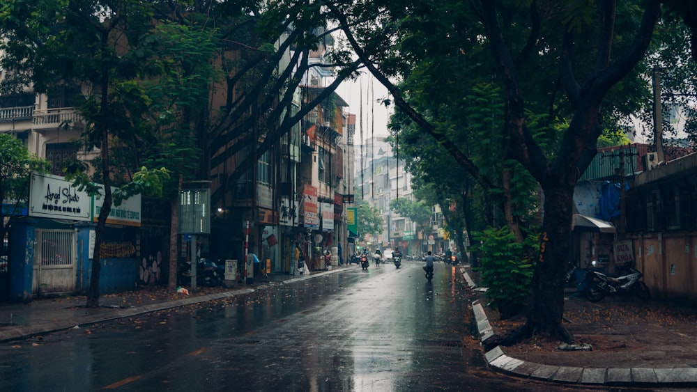 people walking on sidewalk near buildings during daytime