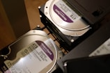 two hard drives are stacked on top of each other