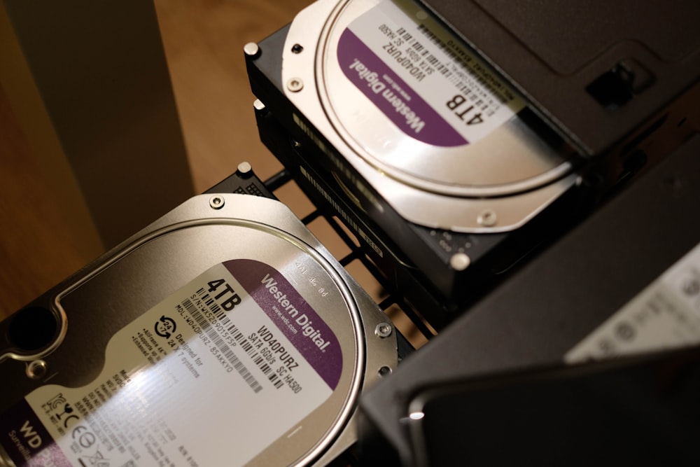 two hard drives are stacked on top of each other