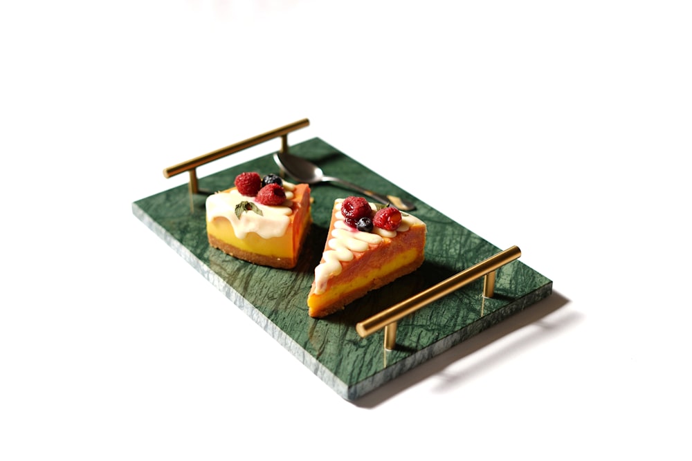 brown and white pastry on green and white ceramic tray