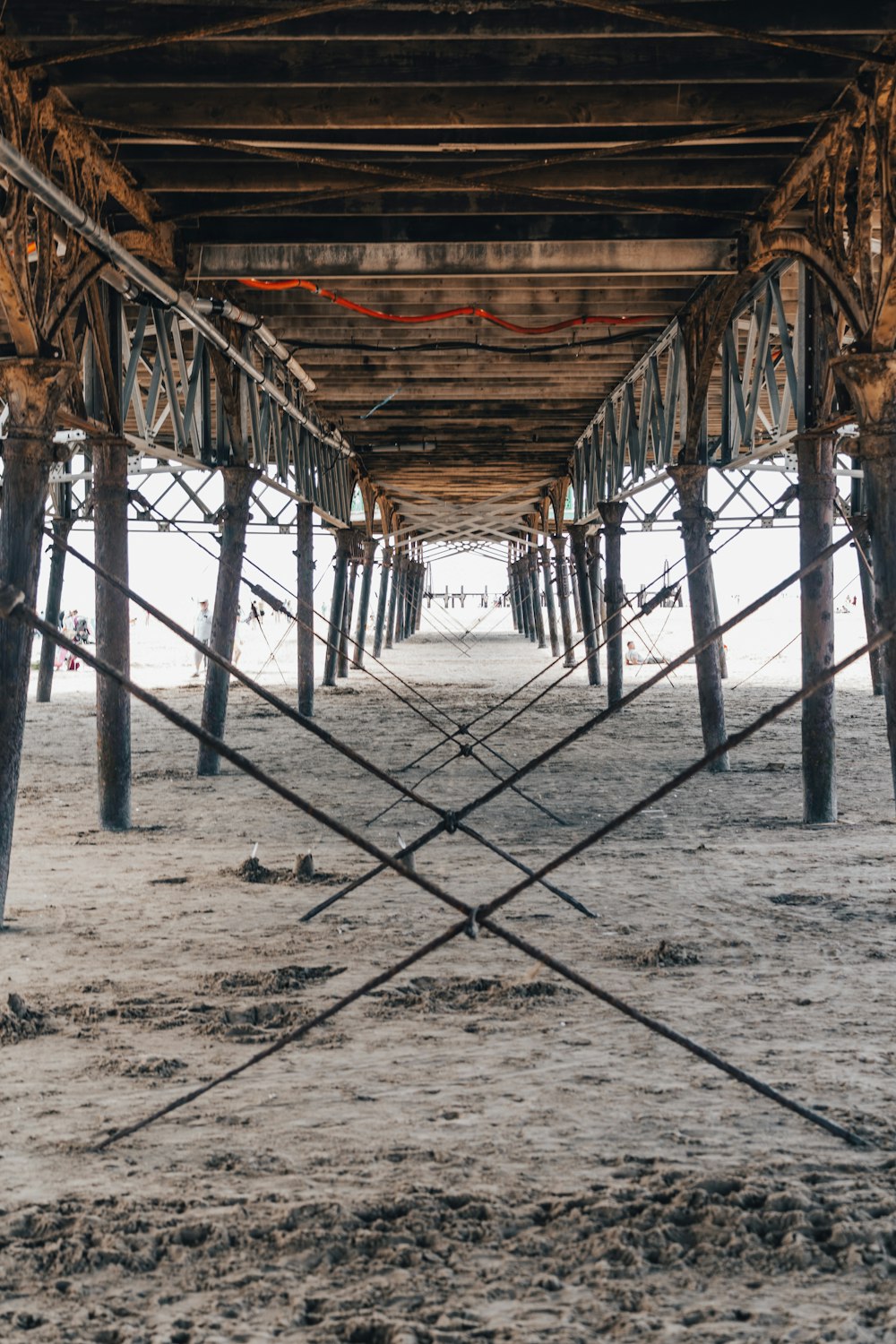 brown wooden dock on beach during daytime