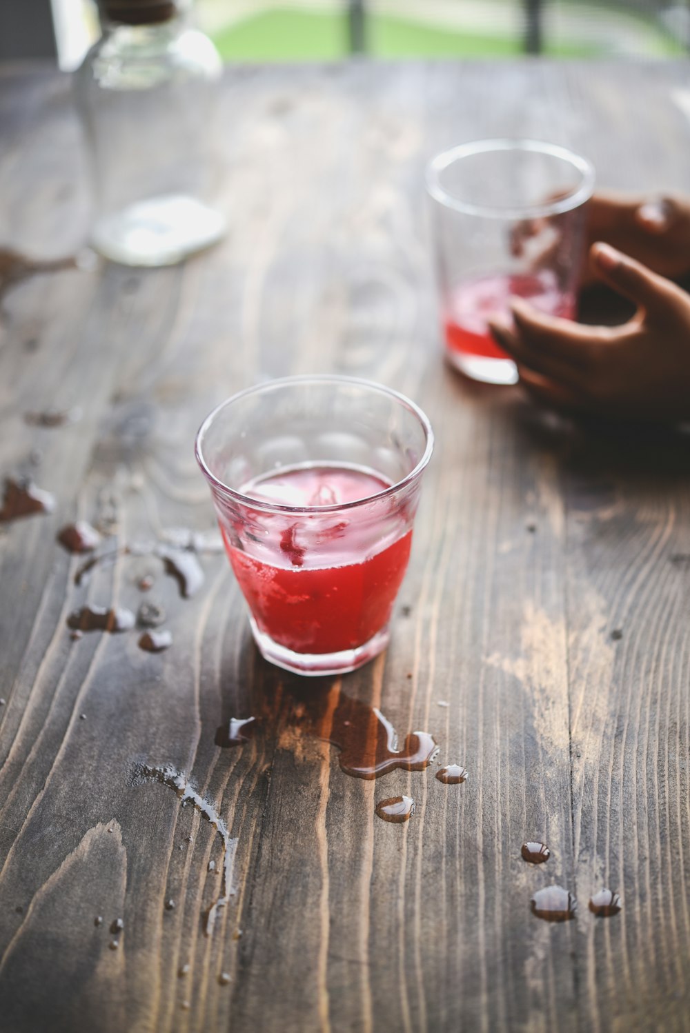 clear drinking glass with red liquid