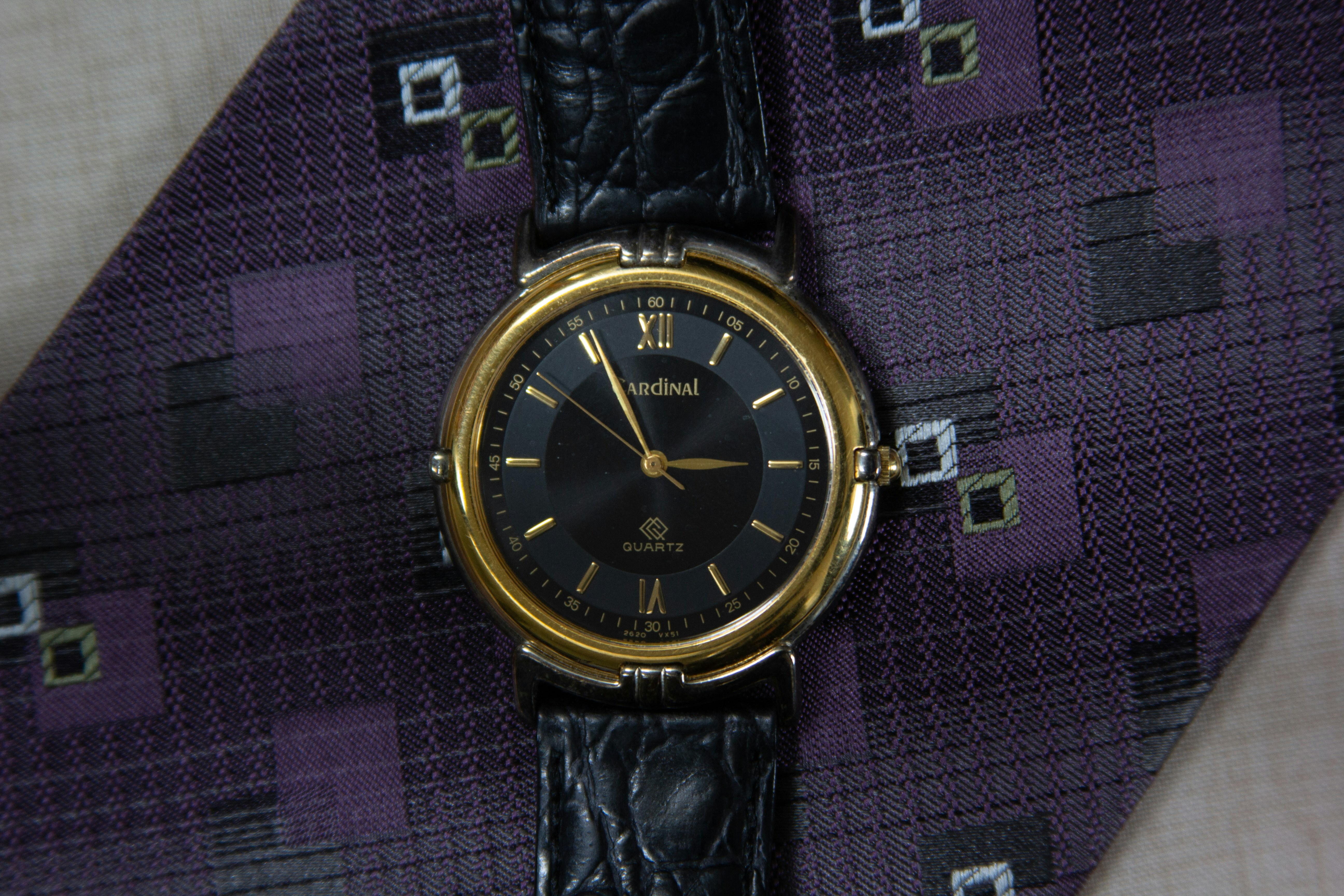 black and silver round analog watch