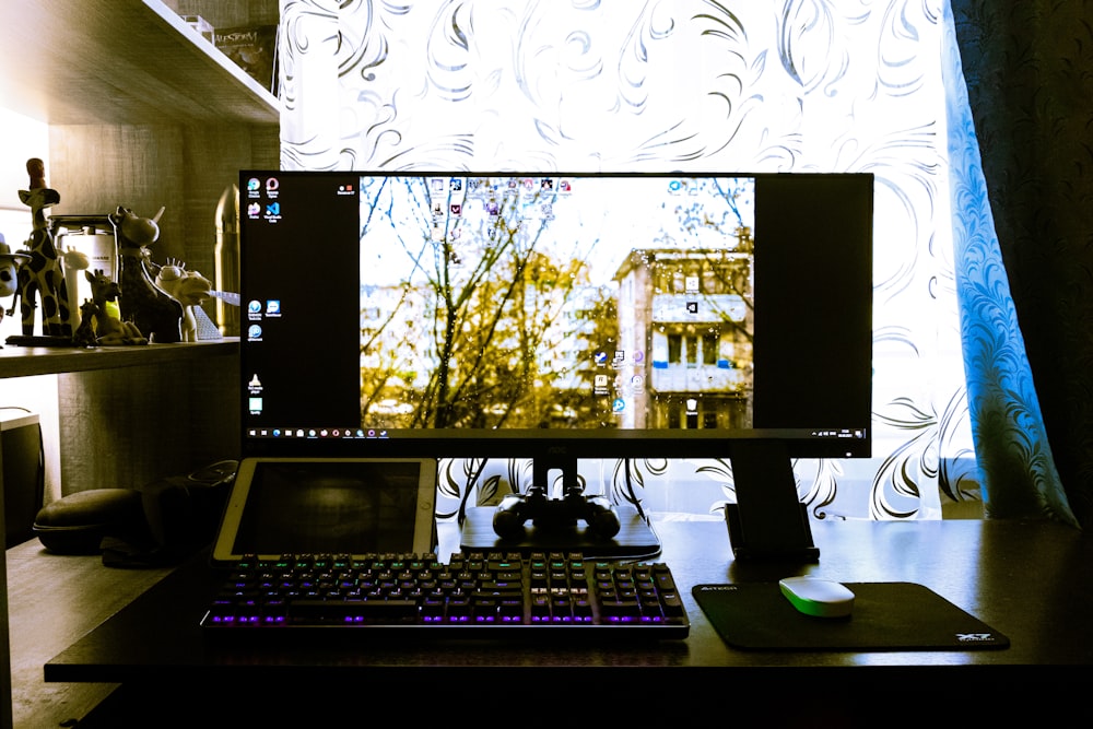 black computer monitor keyboard and computer monitor