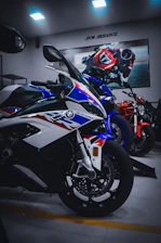 A sleek, modern office space with multiple screens showing live MotoGP races.