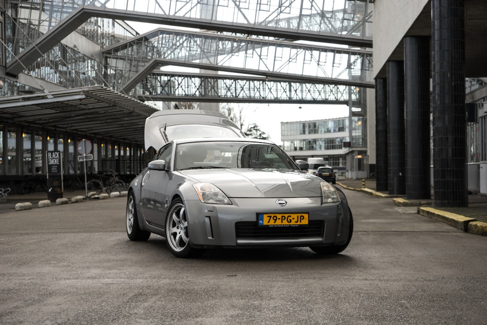 silver porsche 911 parked in garage