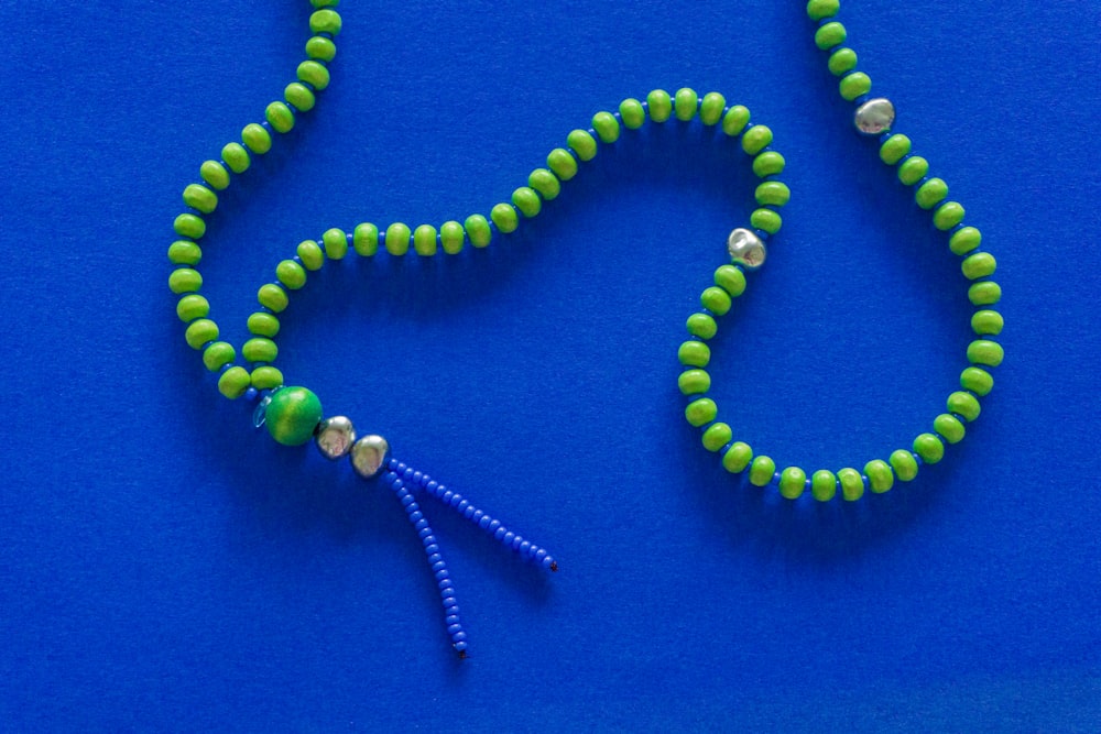 green and white beaded necklace