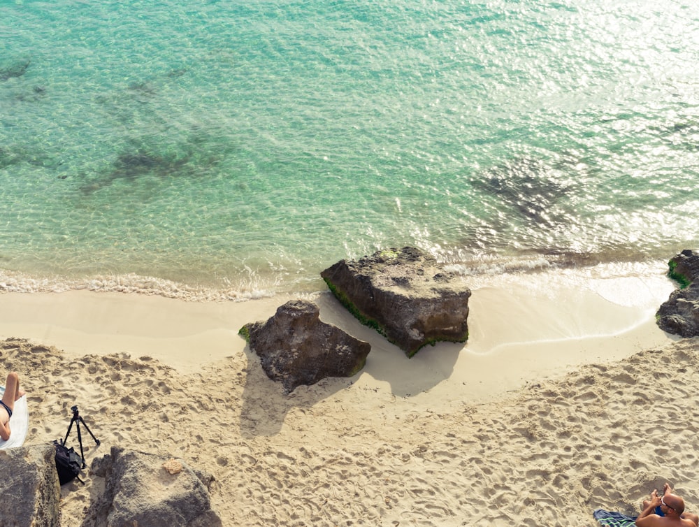 brown rock formation on seashore during daytime