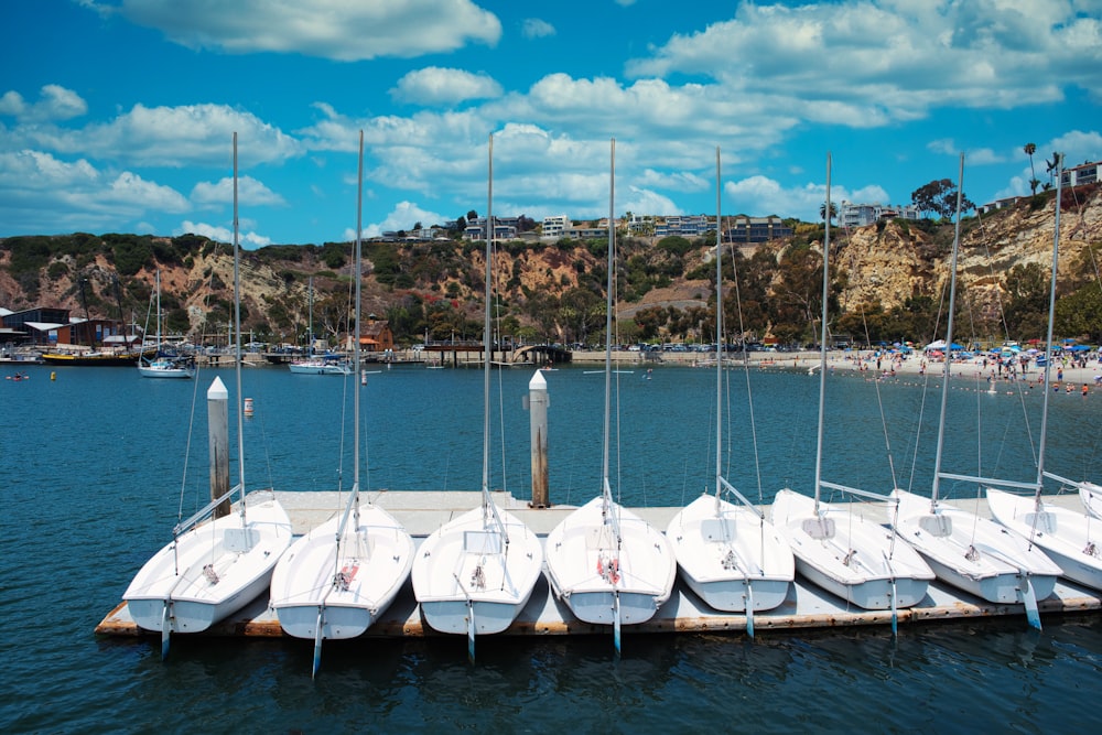 white boats on sea during daytime