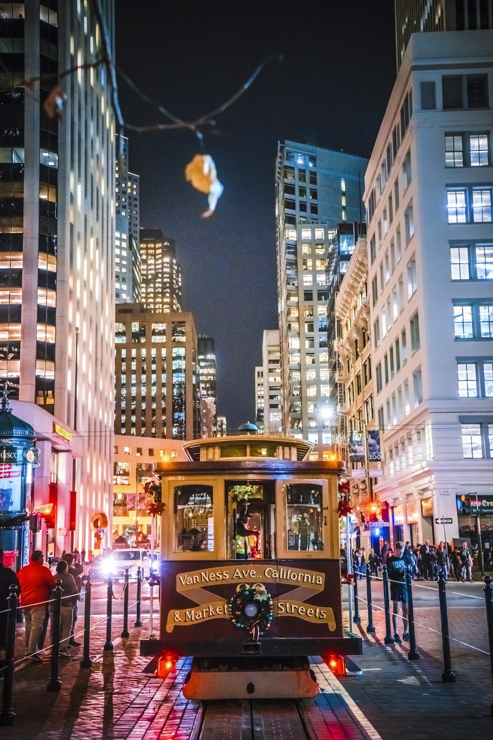 people walking on street during night time