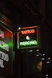 red and white UNKs coffee neon signage