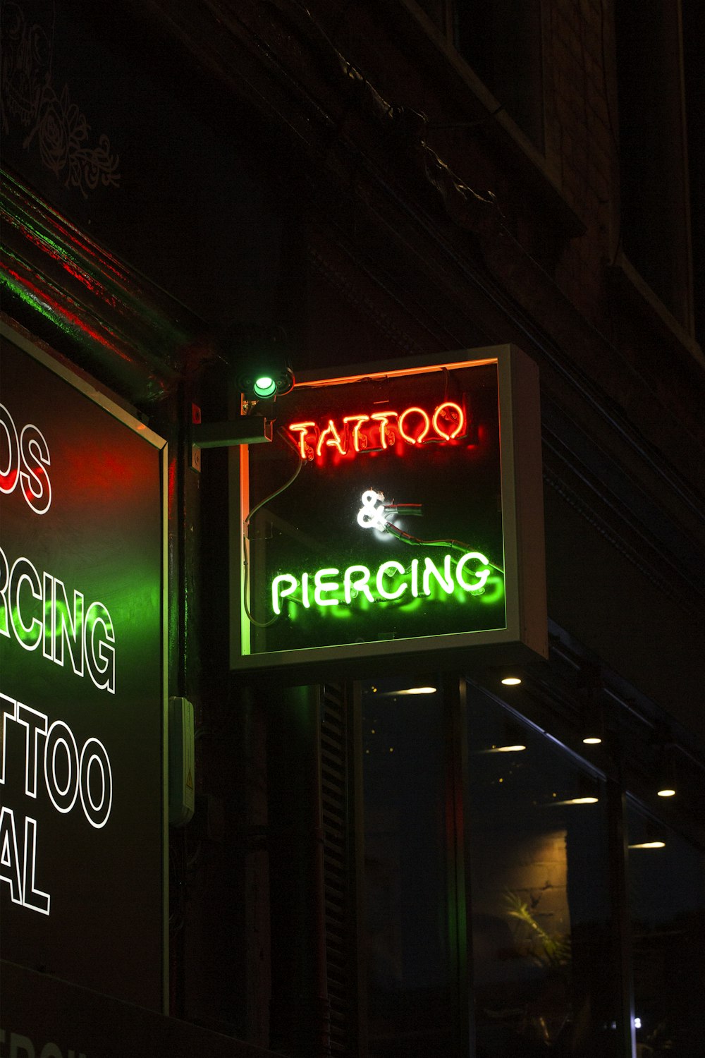 red and white UNKs coffee neon signage