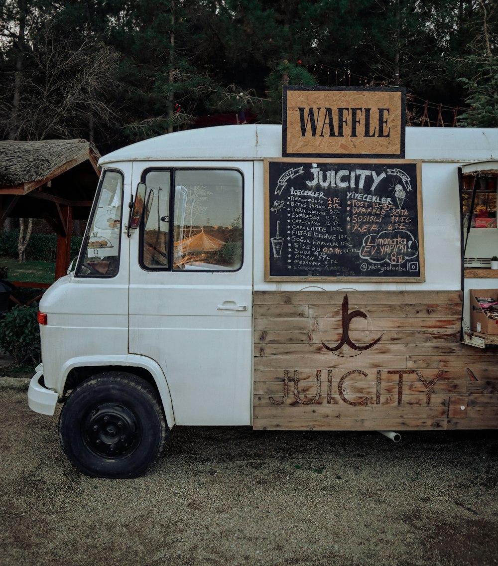 white van with brown wooden board