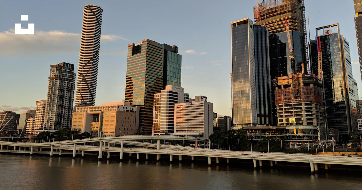 High rise buildings near body of water during daytime photo – Free ...