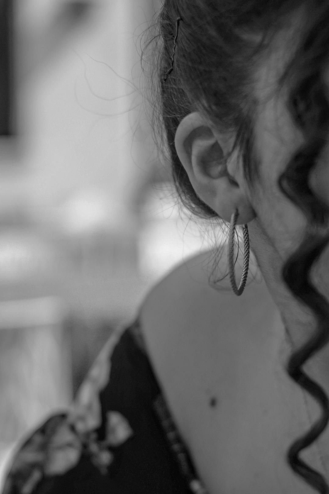 grayscale photo of woman in black and white shirt