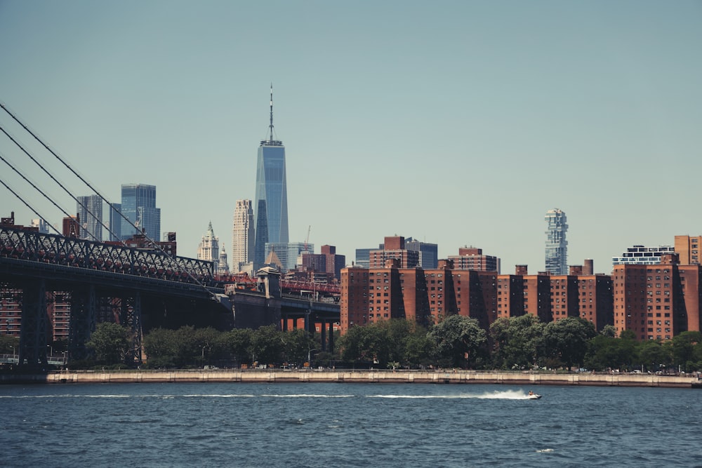 city skyline across body of water during daytime