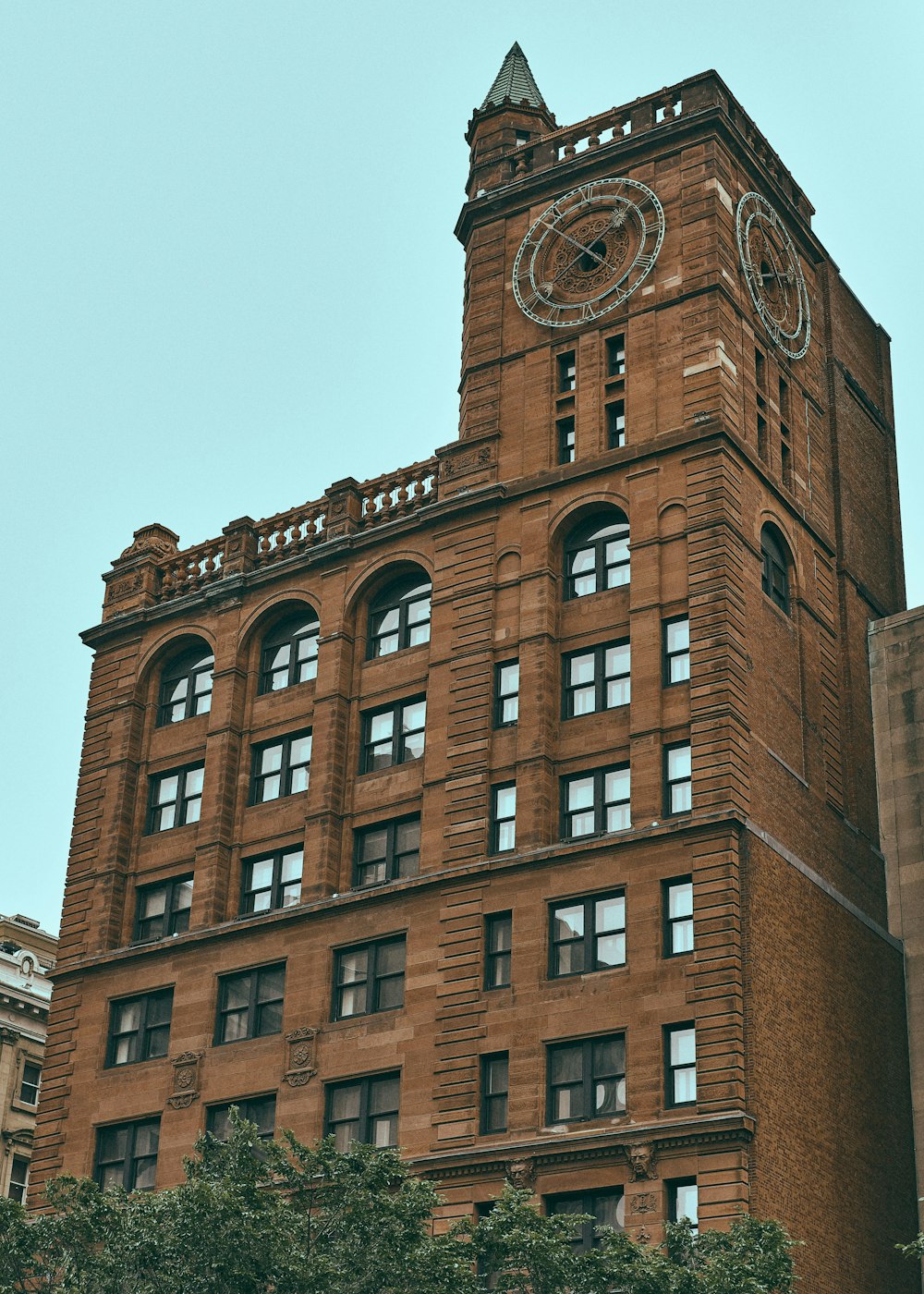 brown concrete building under gray sky during daytime