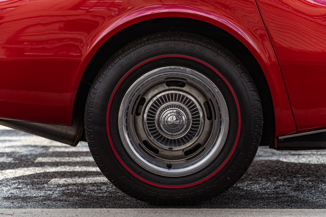 red car on gray asphalt road