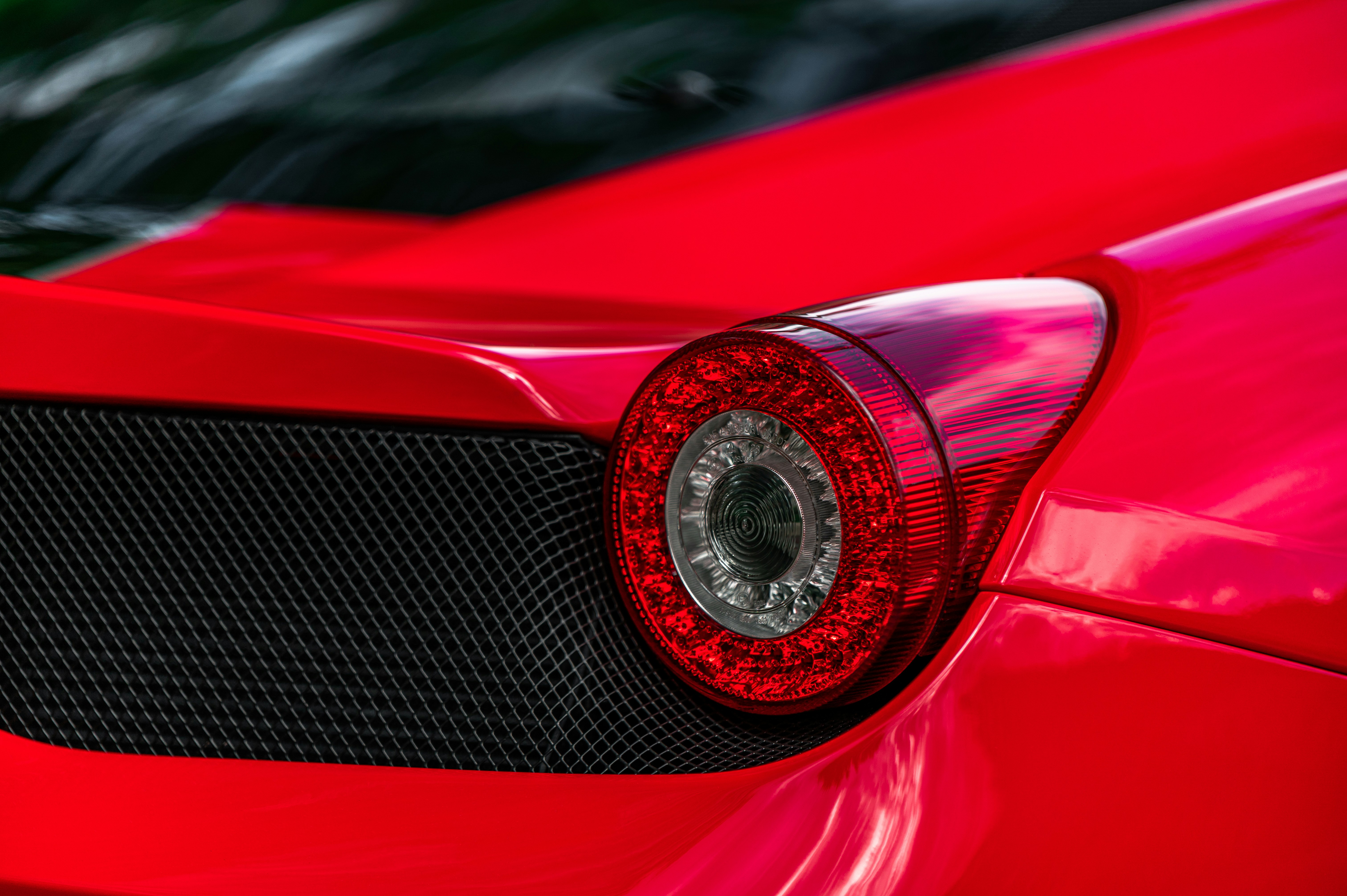 red car with silver round emblem