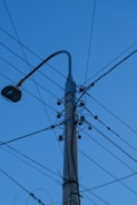 black street light under blue sky during daytime
