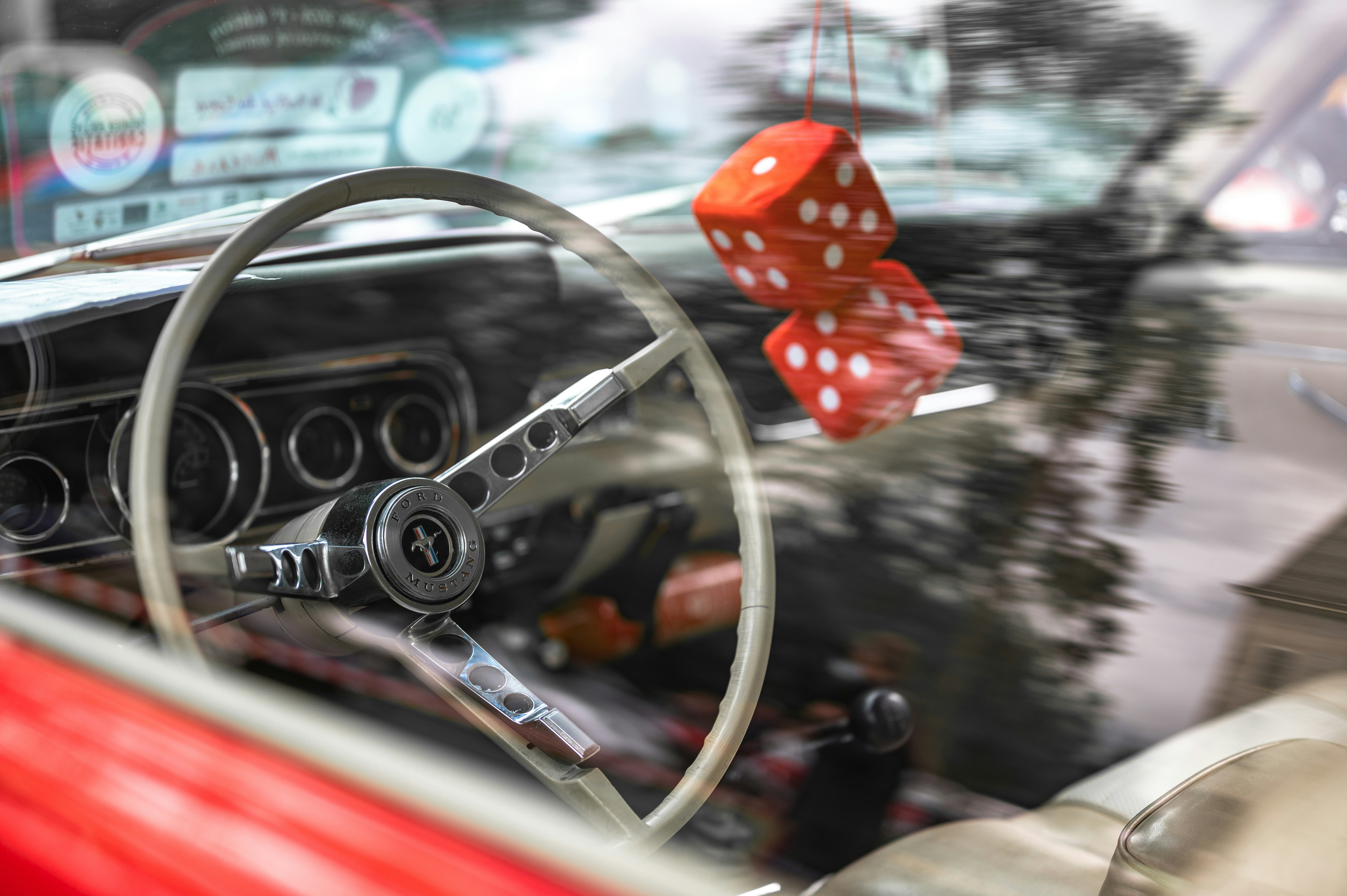 red and black car steering wheel