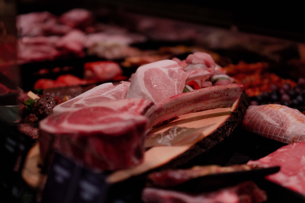 raw meat on brown wooden tray